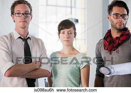 Stock Image - Fashion designers at work. Fotosearch