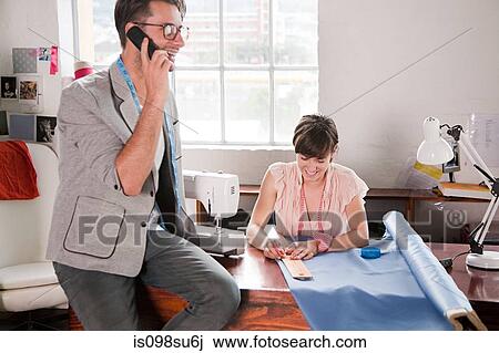 Fashion designers at work View Large Photo Image Stock Image - Fashion designers at work. Fotosearch