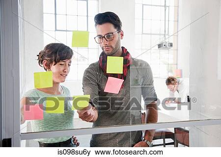 Stock Photo - Fashion designers at work. Fotosearch