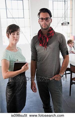 Stock Photograph - Fashion designers at work. Fotosearch