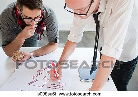 Stock Photograph - Fashion designers at work. Fotosearch
