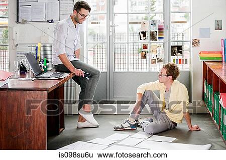 Fashion designers at work View Large Photo Image Stock Photograph - Fashion designers at work. Fotosearch