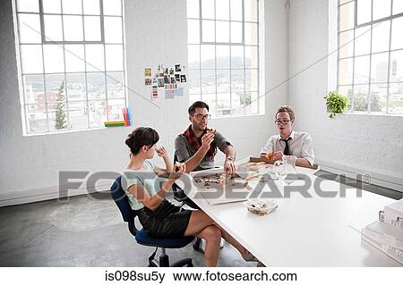 Stock Photo - Fashion designers on lunchbreak. Fotosearch