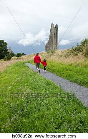 Stock Image - Father and daughter at Trim Castle, County Meath, Ireland. Fotosearch