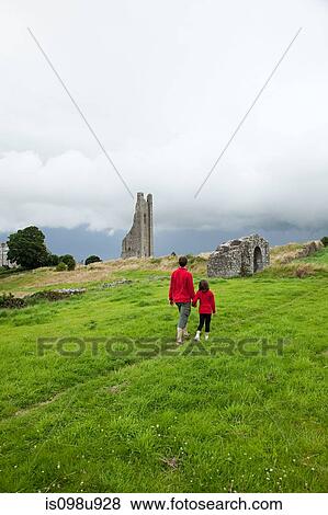 Stock Photo - Father and daughter at Trim Castle, County Meath, Ireland. Fotosearch