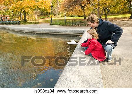 Father and daughter by pond View Large Photo Image Picture - Father and daughter by pond. Fotosearch