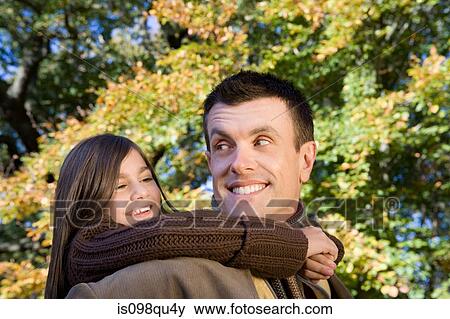 Stock Photo - Father and daughter in park. Fotosearch