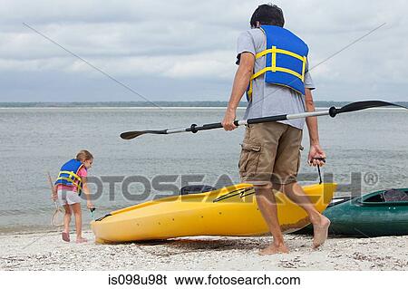 Stock Photograph - Father and daughter kayaking. Fotosearch