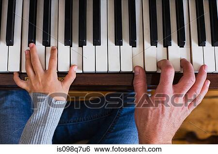 Father and daughter playing piano View Large Photo Image Stock Photograph - Father and daughter playing piano. Fotosearch