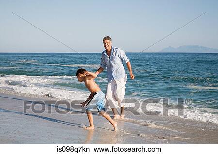 Picture - Father and son by the sea. Fotosearch