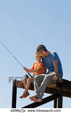 Father and son fishing View Large Photo Image Stock Photo - Father and son fishing. Fotosearch
