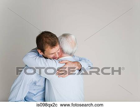 Father and son hugging View Large Photo Image Stock Image - Father and son hugging. Fotosearch