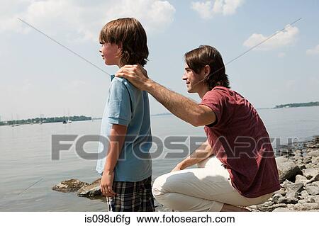 Father and son on beach View Large Photo Image Stock Image - Father and son on beach. Fotosearch