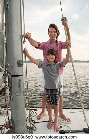 Father and son on board yacht, portrait View Large Photo Image Stock Image - Father and son on board yacht, portrait. Fotosearch