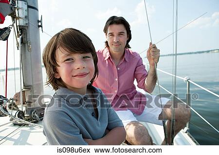 Father and son on board yacht, portrait View Large Photo Image Stock Photo - Father and son on board yacht, portrait. Fotosearch