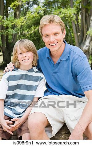 Stock Image - Father and son outdoors. Fotosearch