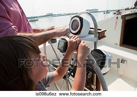 Father and son sailing yacht View Large Photo Image Stock Photo - Father and son sailing yacht. Fotosearch