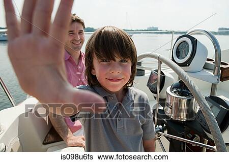 Father and son sailing yacht View Large Photo Image Stock Photograph - Father and son sailing yacht. Fotosearch