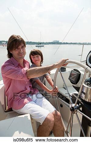 Father and son sailing yacht View Large Photo Image Stock Photography - Father and son sailing yacht. Fotosearch