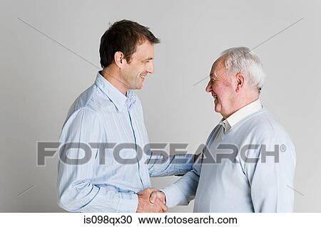 Father and son shaking hands View Large Photo Image Stock Image - Father and son shaking hands. Fotosearch