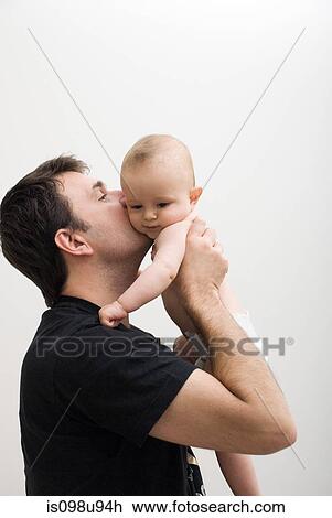 Father holding baby son View Large Photo Image Stock Image - Father holding baby son. Fotosearch