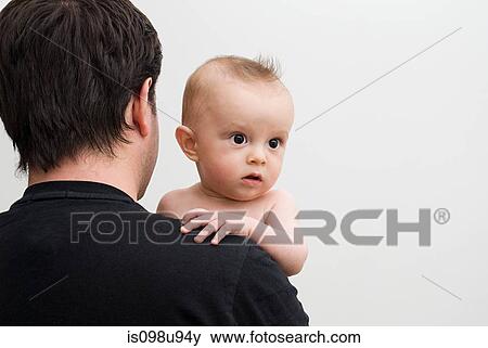 Father holding baby son View Large Photo Image Stock Photo - Father holding baby son. Fotosearch