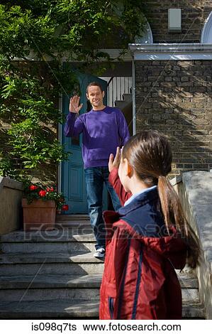 Stock Photograph - Father watching his daughter leave the house. Fotosearch