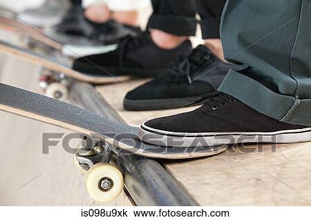 Feet of skaters and boards View Large Photo Image Stock Image - Feet of skaters and boards. Fotosearch