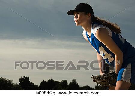 Stock Image - Female baseball player. Fotosearch