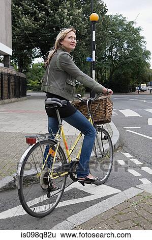 Stock Photograph - Female cyclist. Fotosearch