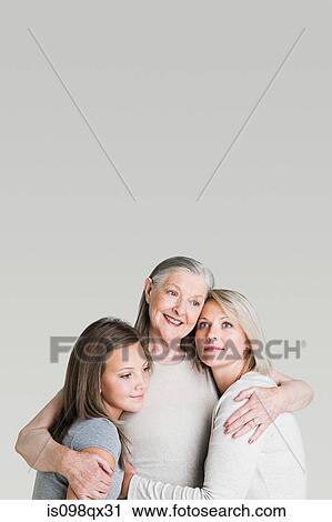 Female family members hugging View Large Photo Image Stock Image - Female family members hugging. Fotosearch