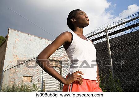 Stock Image - Female runner in brooklyn. Fotosearch