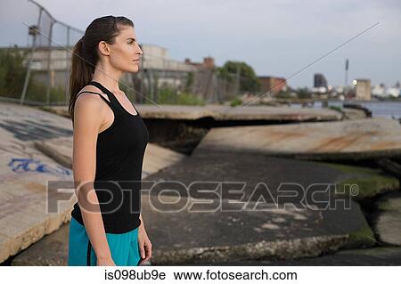 Stock Image - Female runner in brooklyn. Fotosearch