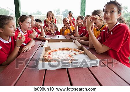 Female soccer team having pizza View Large Photo Image Stock Image - Female soccer team having pizza. Fotosearch