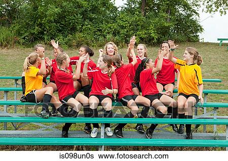 Female soccer team high fiving View Large Photo Image Stock Photograph - Female soccer team high fiving. Fotosearch