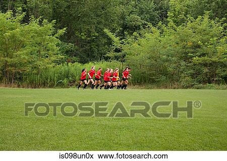 Stock Photo - Female soccer team running. Fotosearch