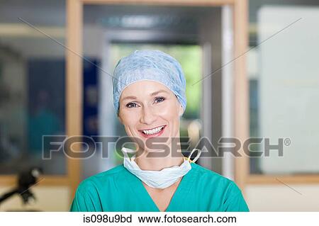 Stock Image - Female surgeon in scrubs. Fotosearch
