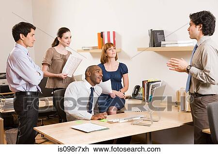Five office workers in a meeting View Large Photo Image Stock Image - Five office workers in a meeting. Fotosearch