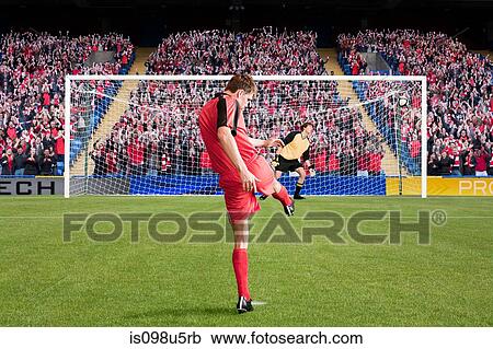 Stock Image - Football scoring a goal. Fotosearch