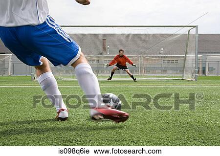 Footballer and goalkeeper View Large Photo Image Stock Image - Footballer and goalkeeper. Fotosearch