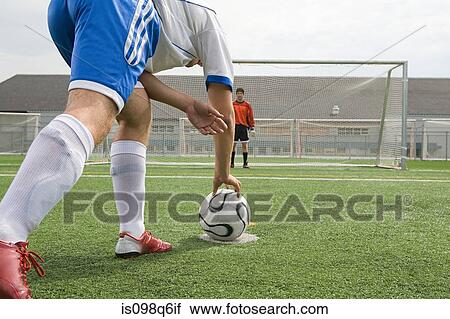 Footballer and goalkeeper View Large Photo Image Stock Image - Footballer and goalkeeper. Fotosearch