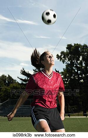Footballer heading the ball View Large Photo Image Stock Image - Footballer heading the ball. Fotosearch