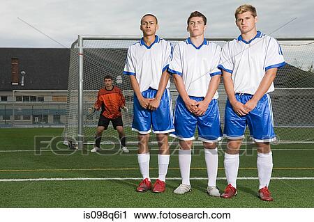 Footballers waiting for free kick View Large Photo Image Stock Image - Footballers waiting for free kick. Fotosearch