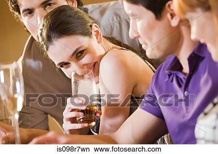 Four friends in a bar View Large Photo Image Picture - Four friends in a bar. Fotosearch