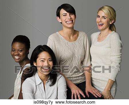 Stock Photo - Four women laughing. Fotosearch