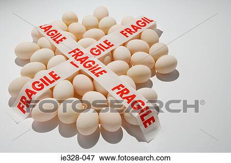 Fragile tape on eggs View Large Photo Image Stock Photo - Fragile tape on eggs. Fotosearch
