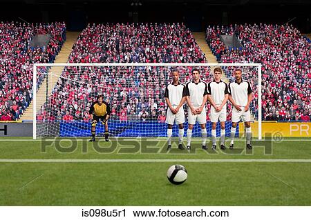 Stock Image - Free kick during a football match. Fotosearch