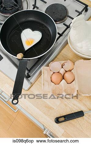 Stock Photography - Fried egg in heart shape. Fotosearch