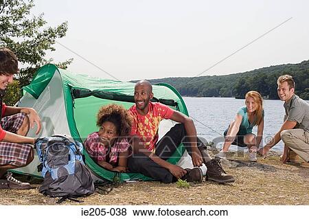 Stock Photo - Friends camping. Fotosearch