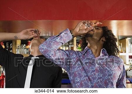 Friends downing shots View Large Photo Image Picture - Friends downing shots. Fotosearch